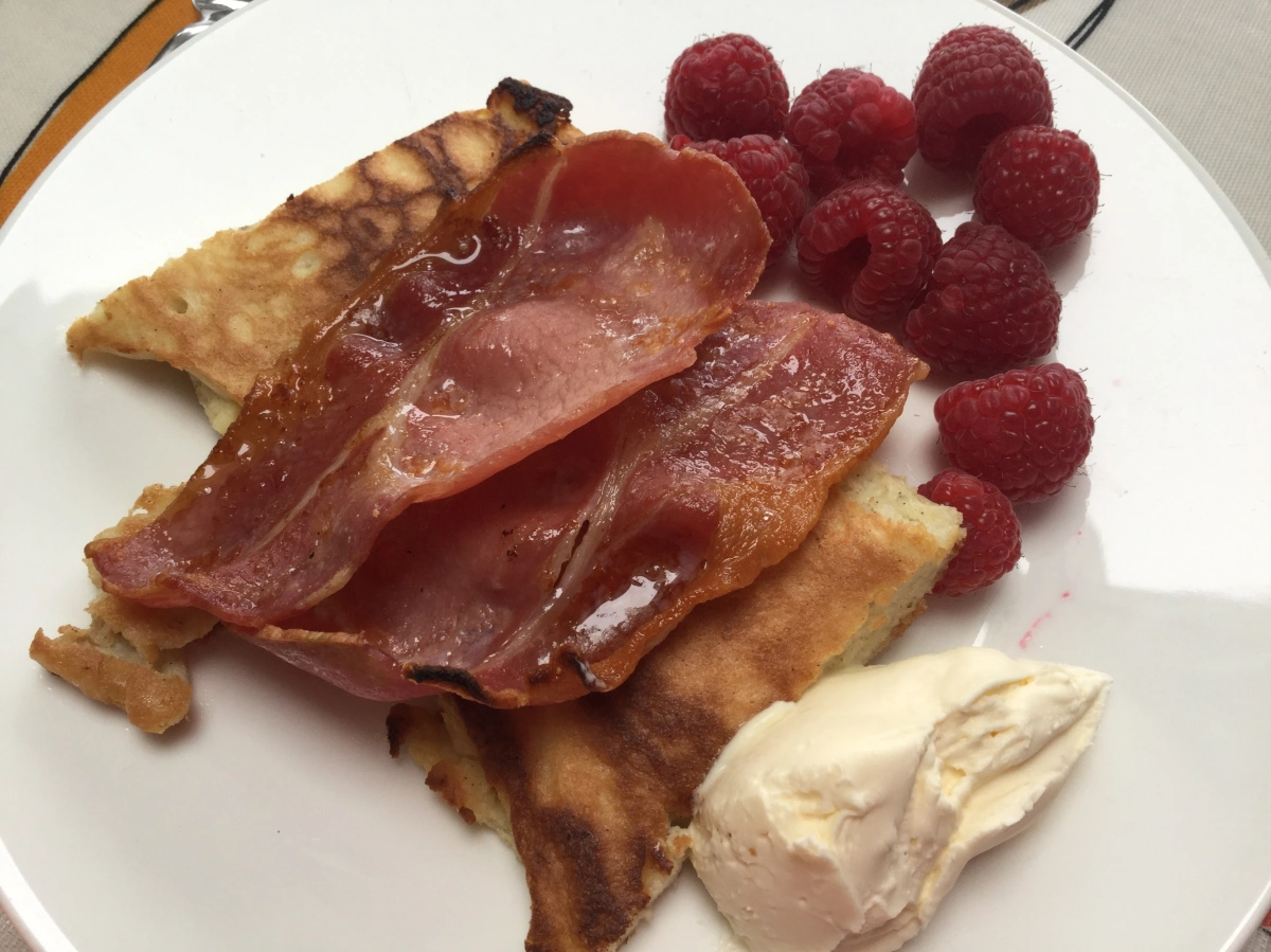 Coconut pancakes with bacon and raspberries