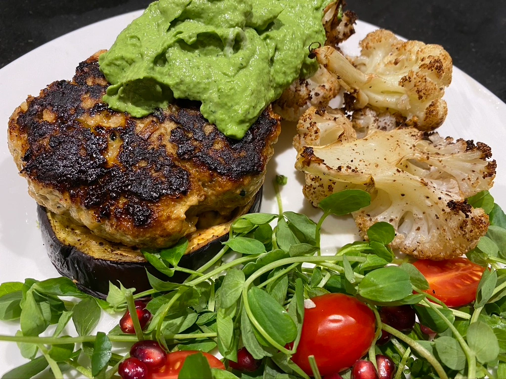 Moroccan Turkey Burgers with roasted aubergine, cauliflower, with avocado and dill pesto
